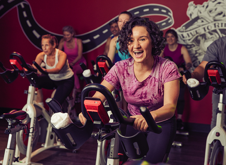 Woman smiling in spin class