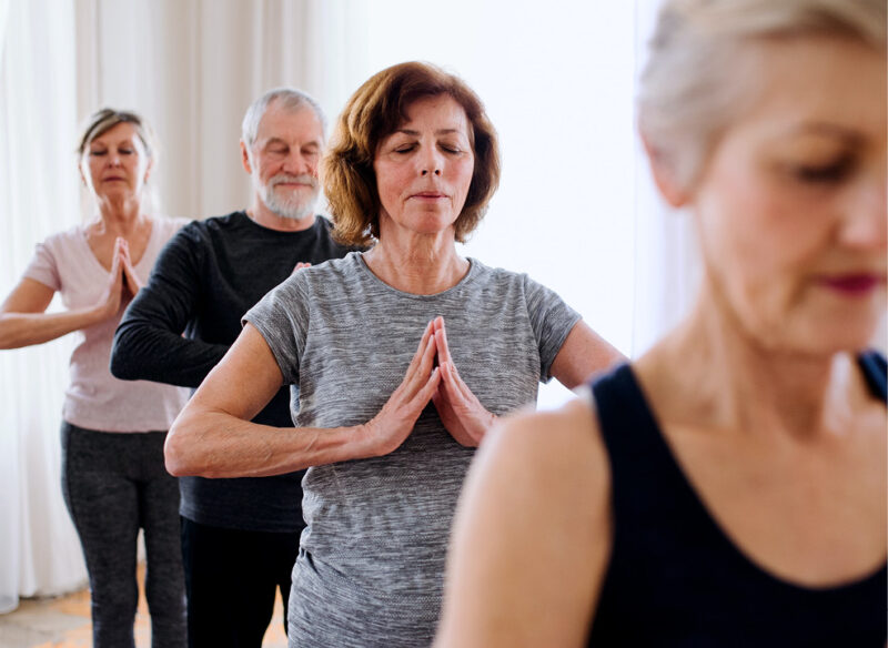 Old people in group fitness class