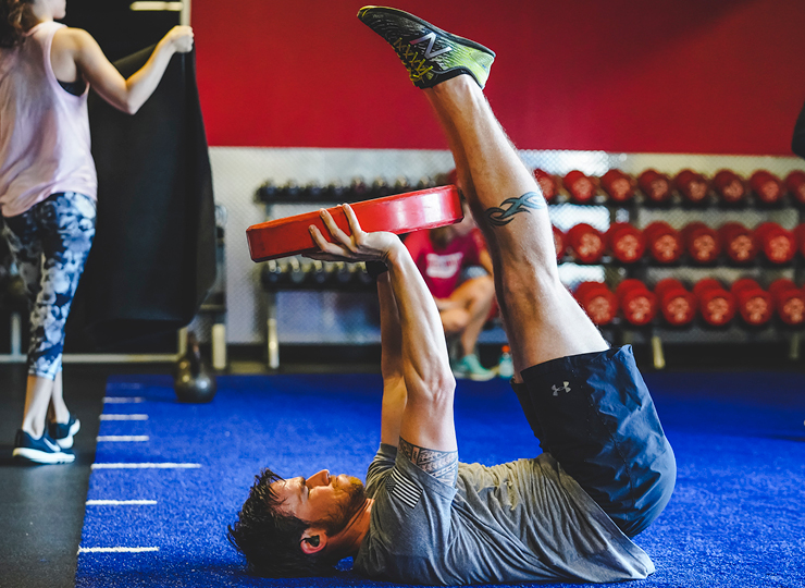 people in badass bootcamp class at crunch fitness