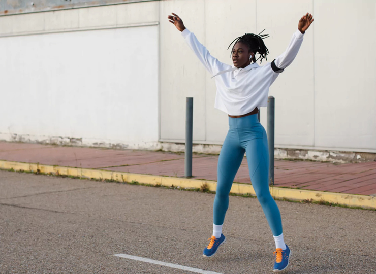 woman doing jumping jacks