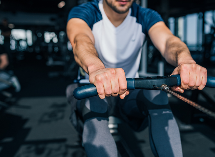 person on rowing machine