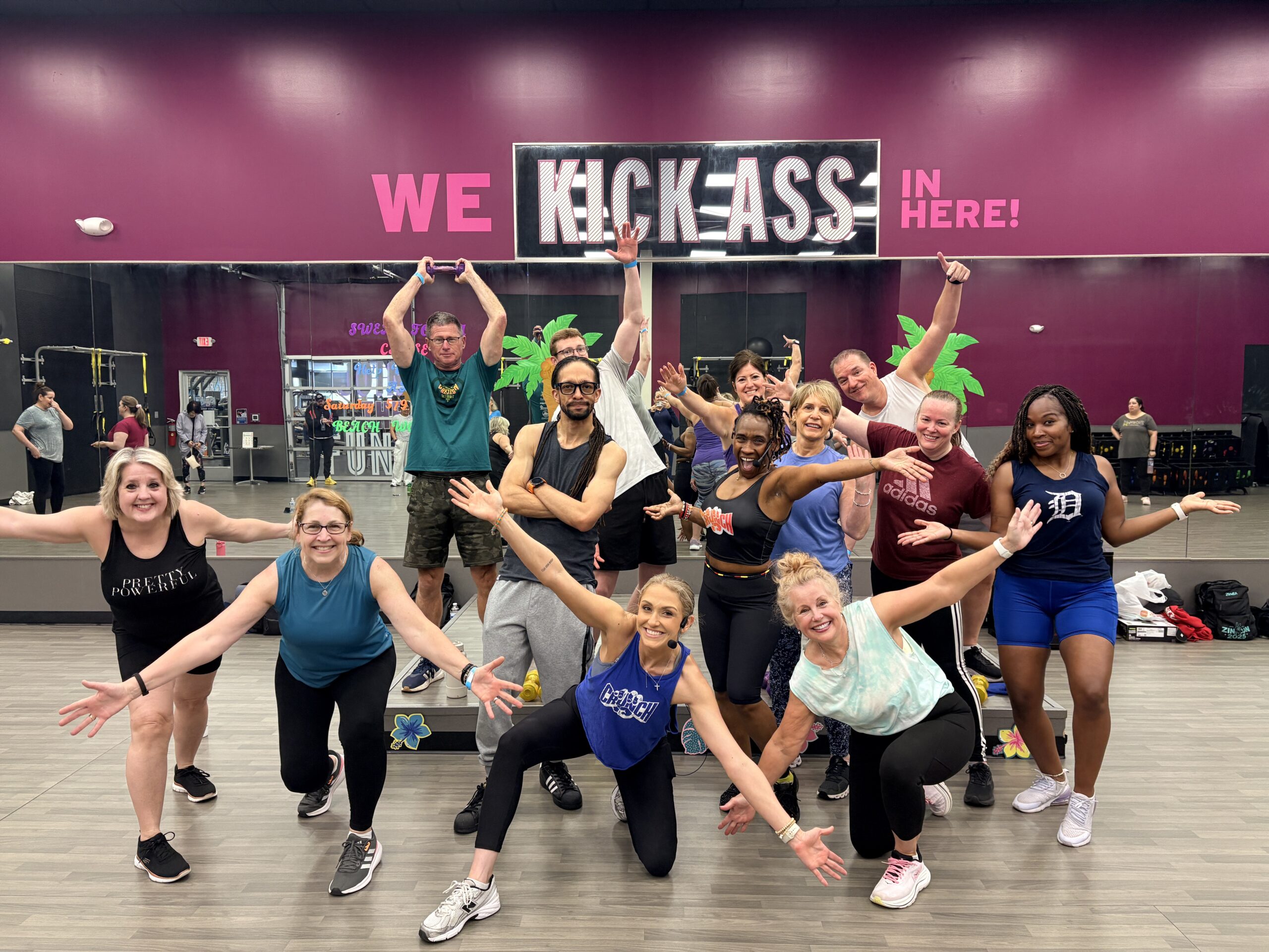 Gym-goers posing at Augie's quest event